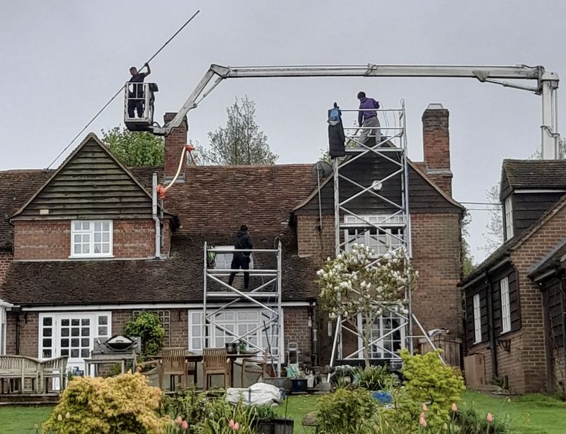 The Moss Cleaners using cherry picker and scaffolding to clean roof safely and professionally in 3 Milton Rd, London SW14 8JP, UK, 3 Milton Rd, London SW14 8JP, UK